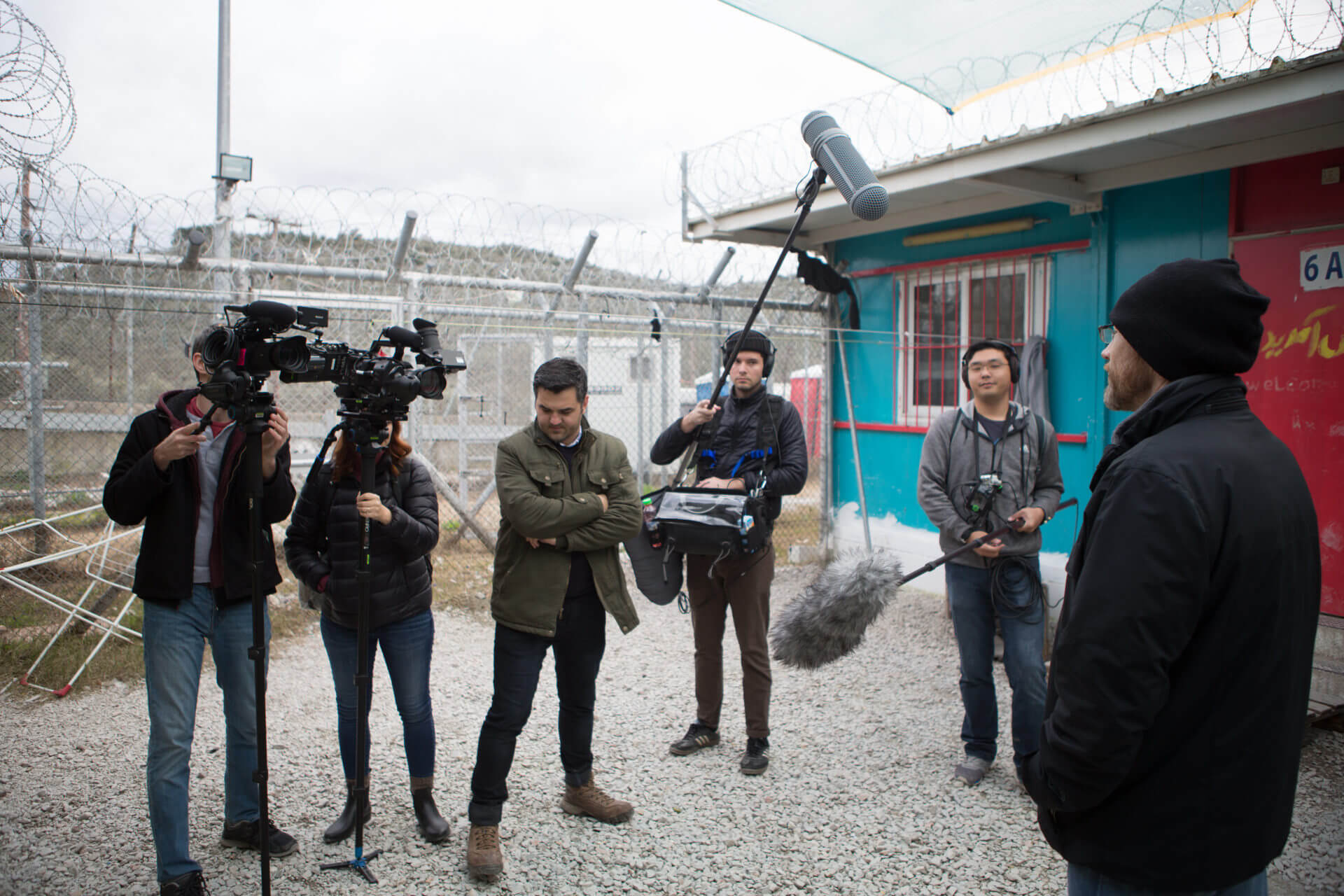 Director Daniel Druhora and several members of the documentary film crew have cameras and microphones pointed at course instructor Brad Cracchiola inside Camp Moria.